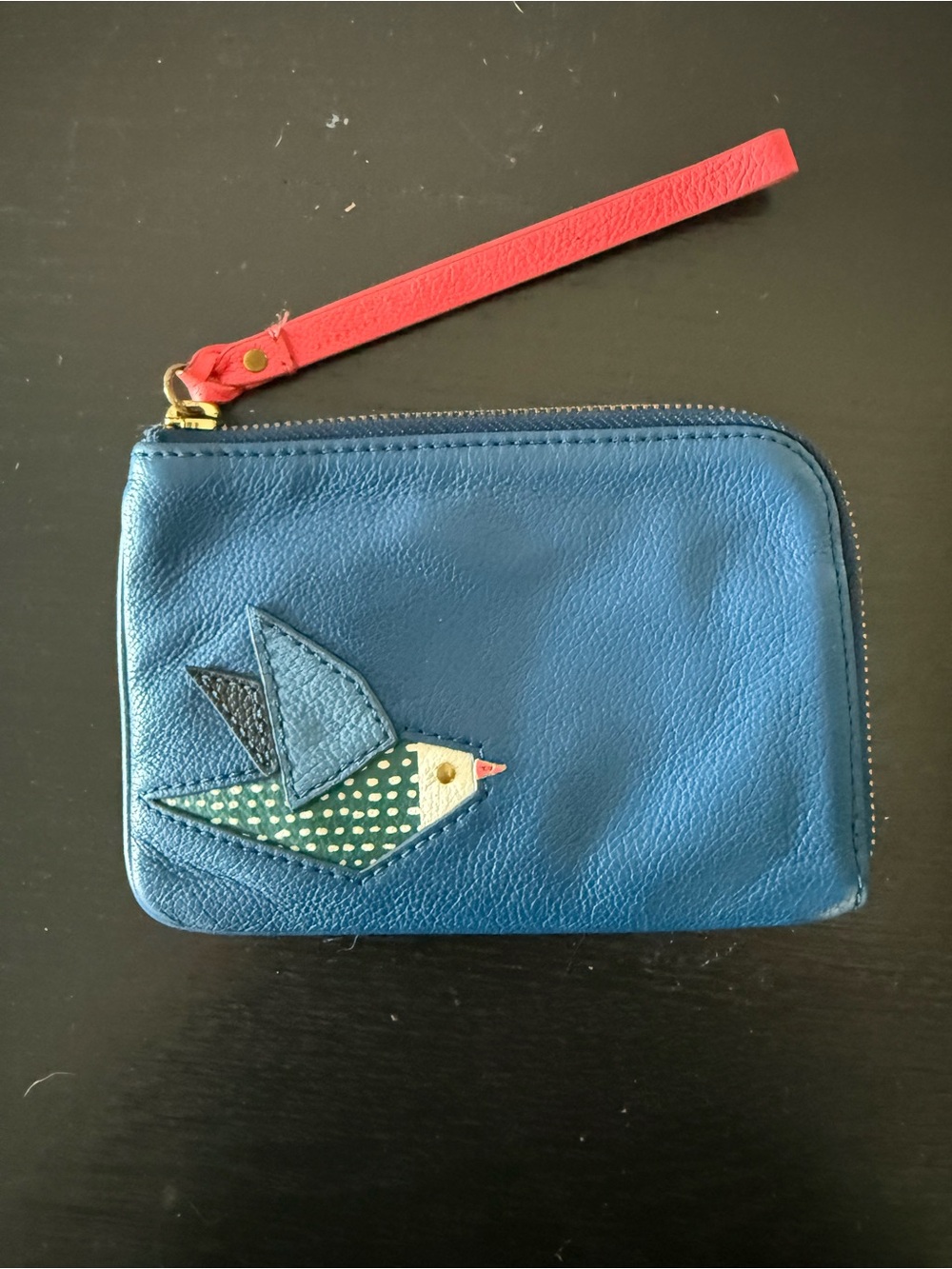 Fossil Blue Leather Wristlet with Red Strap and Multicolor Bird Appliqué
